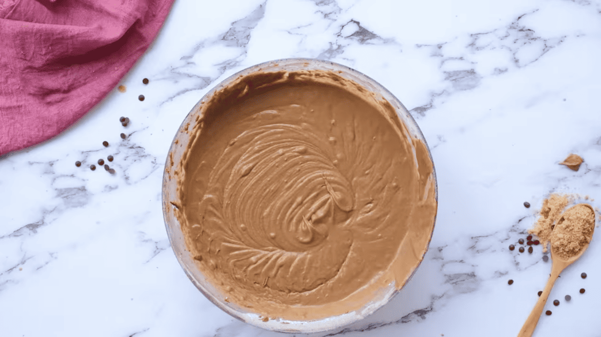 thin chocolate cake batter in a glass bowl.