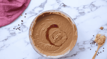 Peanut butter and chocolate bundt cake with a spoon.