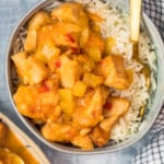 sweet and sour chicken in a bowl with rice