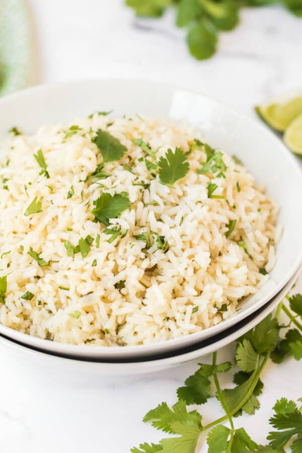 side image of cilantro lime rice in white bowl