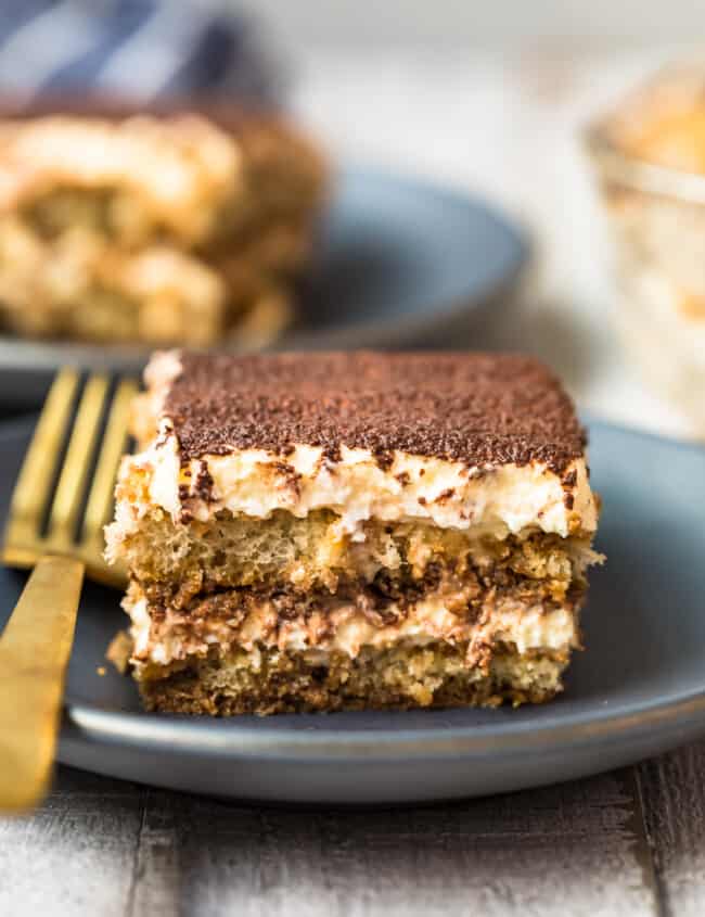 slice of tiramisu on black plate