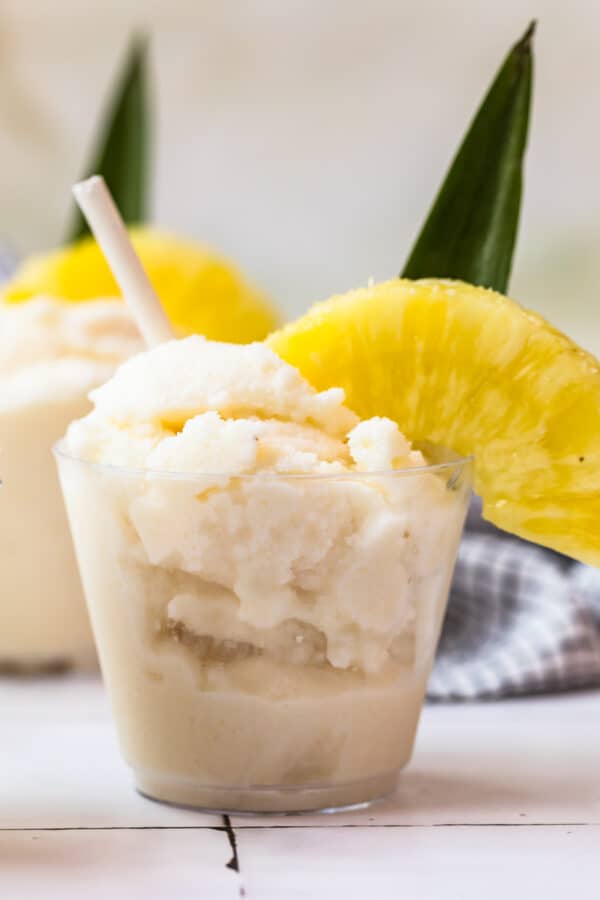 frozen pina coladas garnished with pineapple