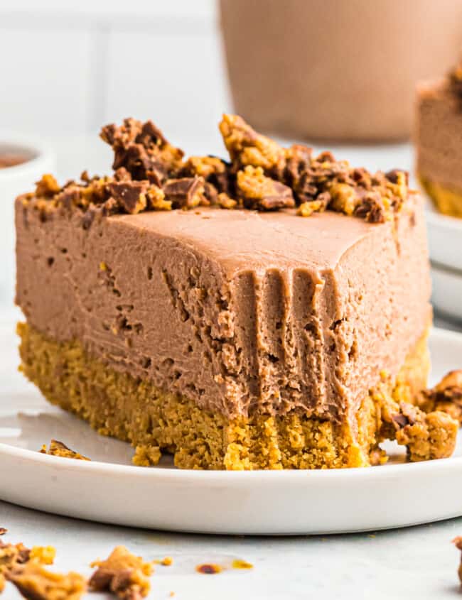 peanut butter cup no bake cheesecake on plate