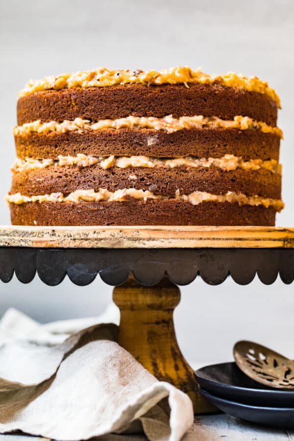 layered german chocolate cake on cake stand