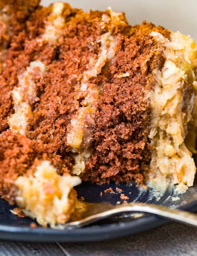 slice of german chocolate cake on black plate