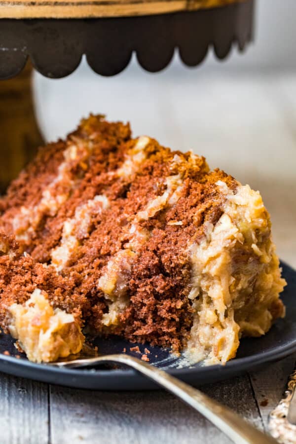 slice of german chocolate cake on black plate