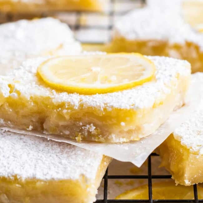 up close sliced lemon bar topped with lemon slice