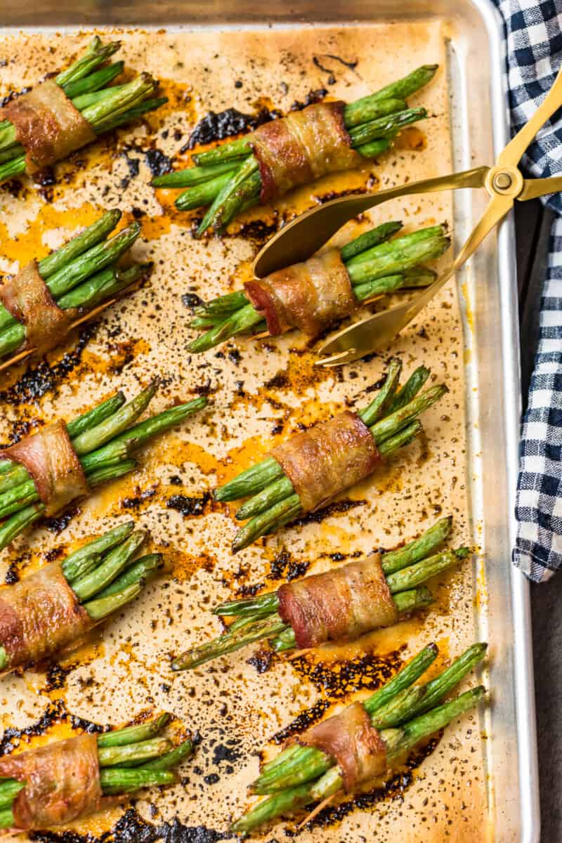 bacon wrapped green bean bundles on baking sheet