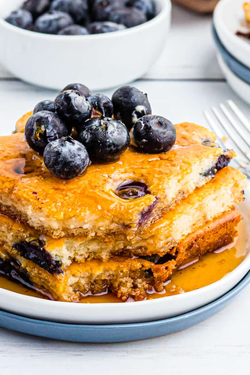 up close image of sheet pan blueberry pancakes with syrup