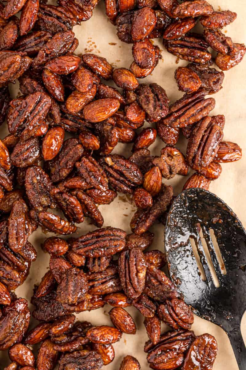 slow cooker spiced candied nuts on parchment