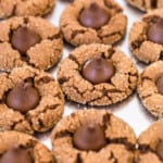 chocolate peanut butter blossoms on baking sheet