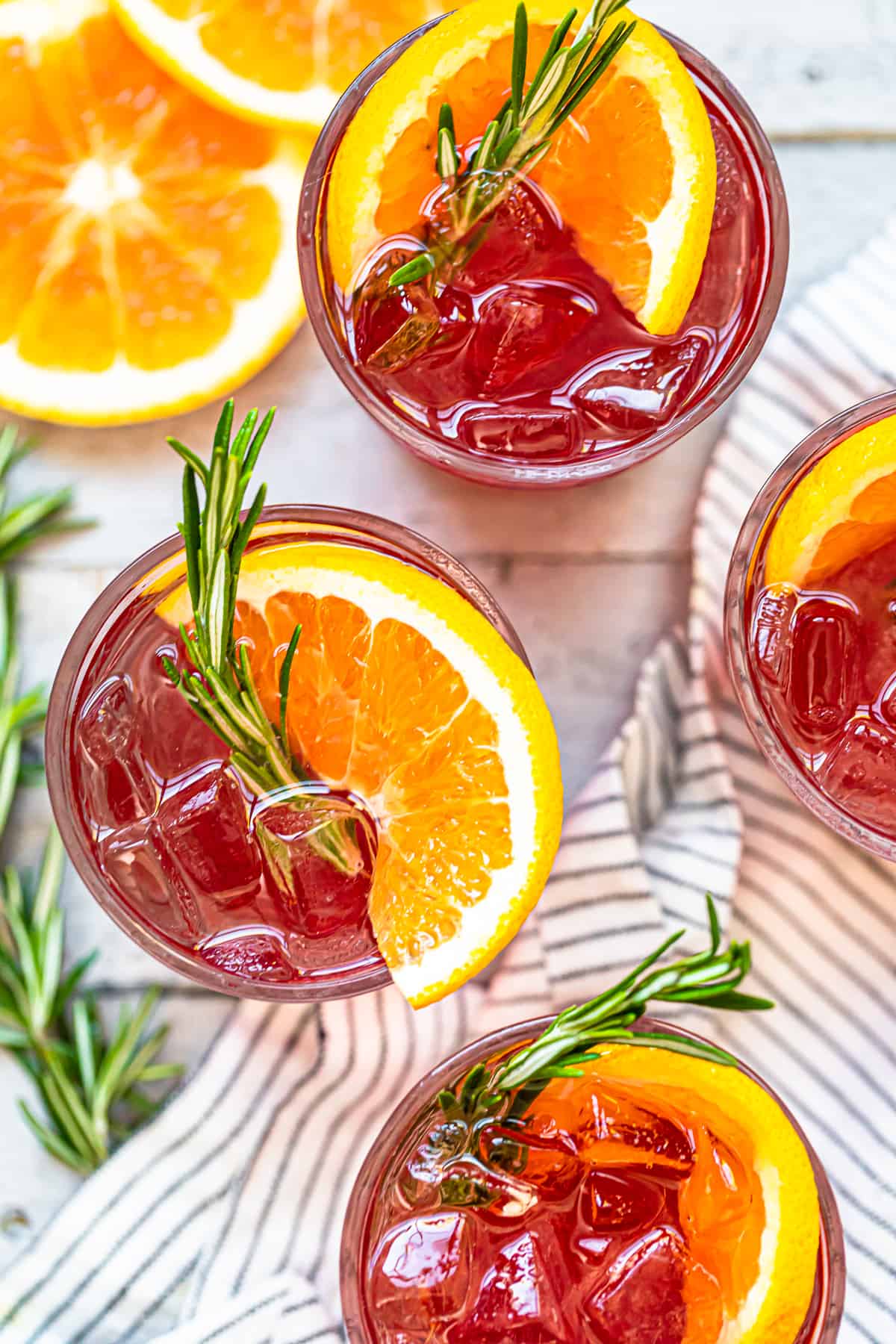 overhead orange cranberry bourbon smash cocktails in glasses