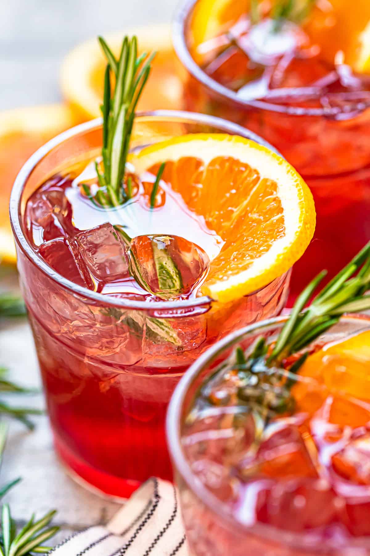 orange cranberry bourbon smash cocktails in glasses