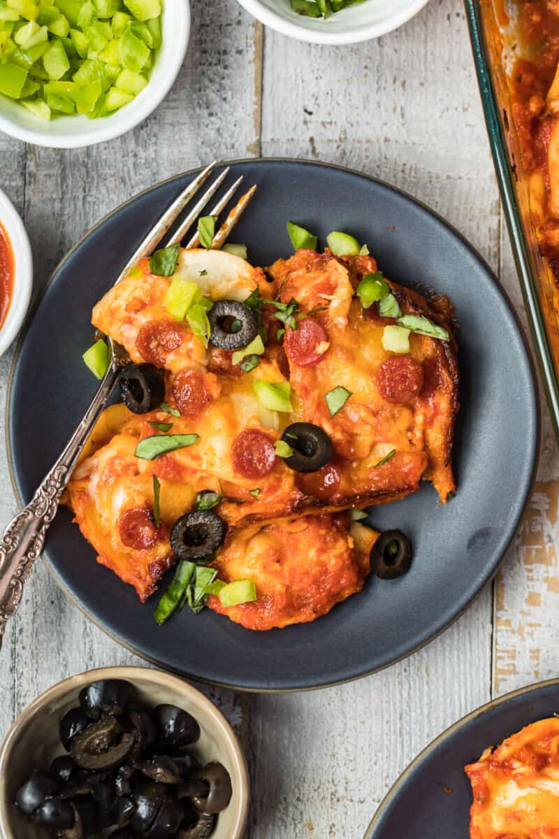 plated pizza pierogy casserole with olives and green pepper toppings