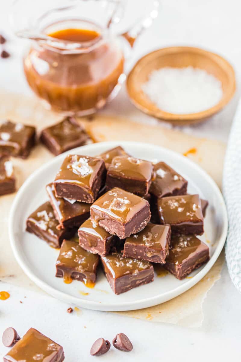 stacked salted caramel chocolate fudge on white plate