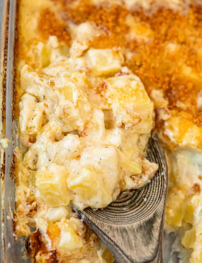 spoon digging into parmesan creamed potatoes