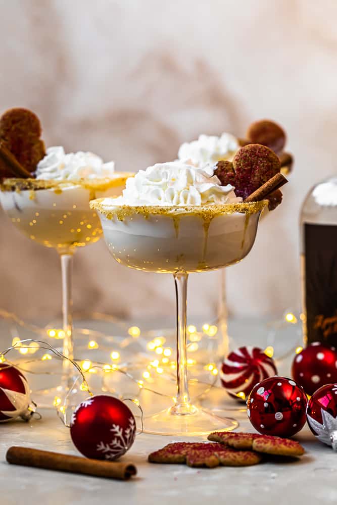 3 gingerbread martinis with christmas decorations and homemade ginger syrup.