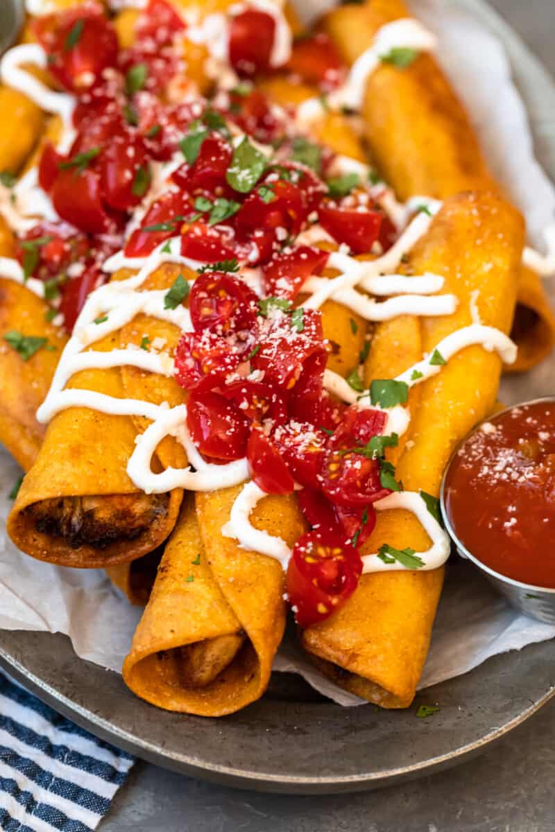 side image chicken taquitos on platter