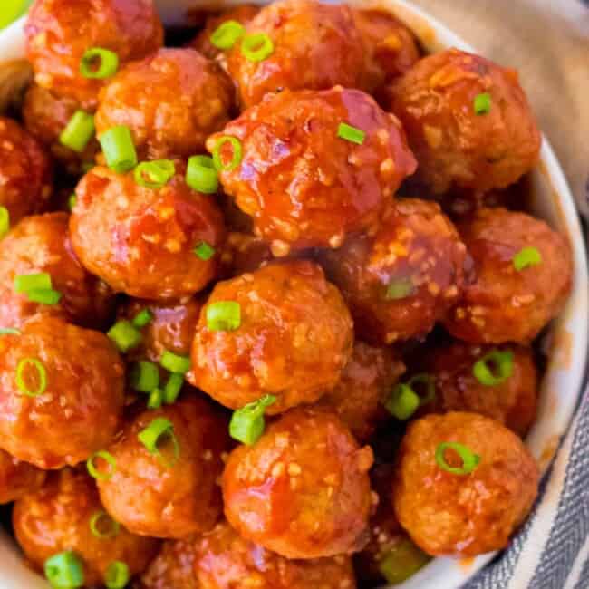 up close bowl of crockpot honey garlic meatballs