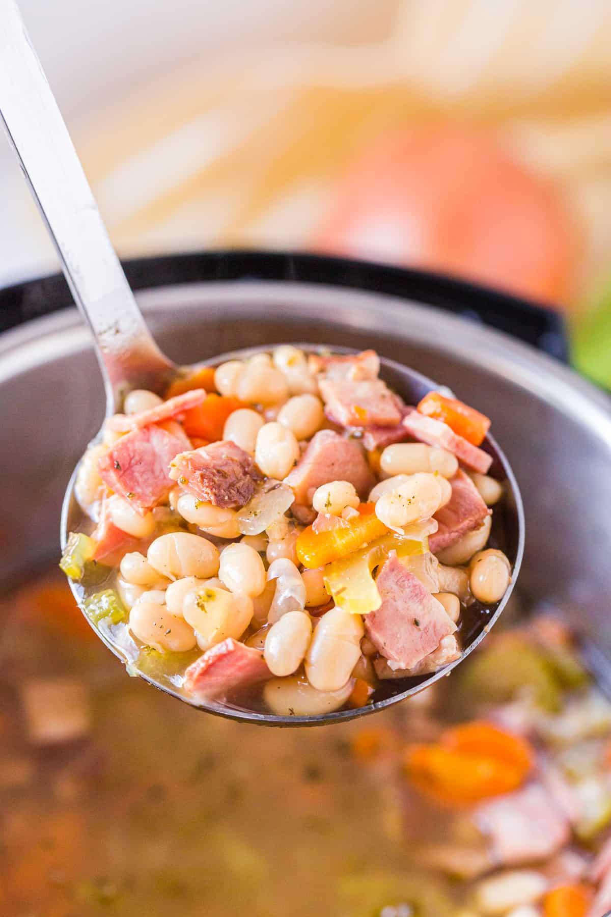 ladle of ham and bean soup made in instant pot