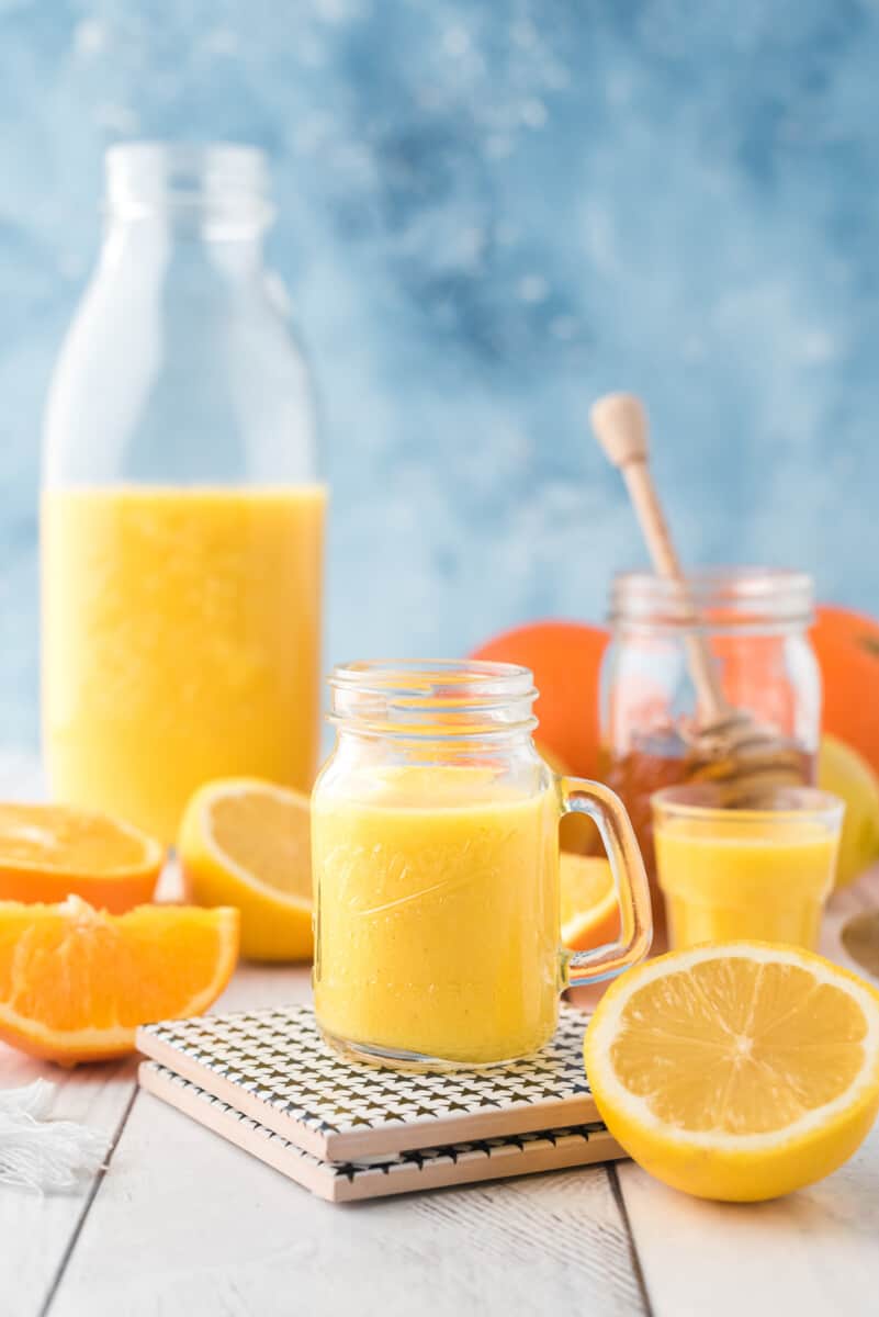 orange ginger shot on table