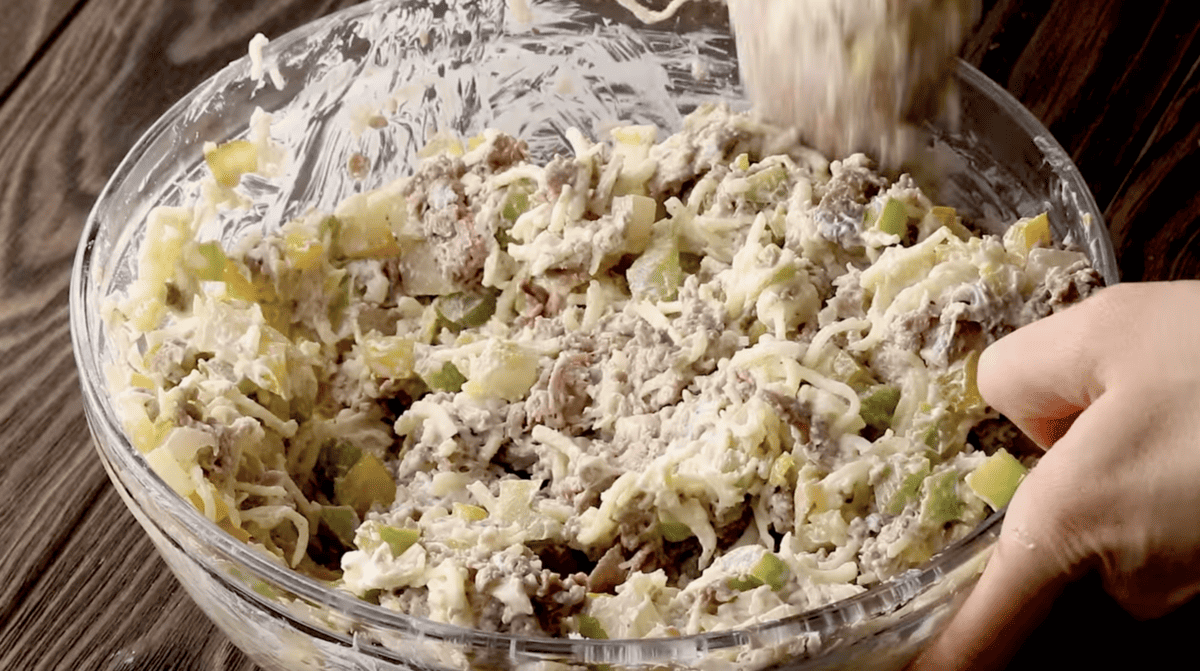 philly cheesesteak dip in a glass bowl.