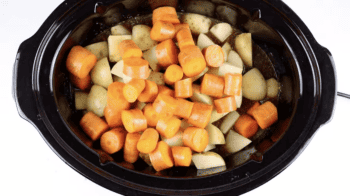 diced veggies in a crockpot.