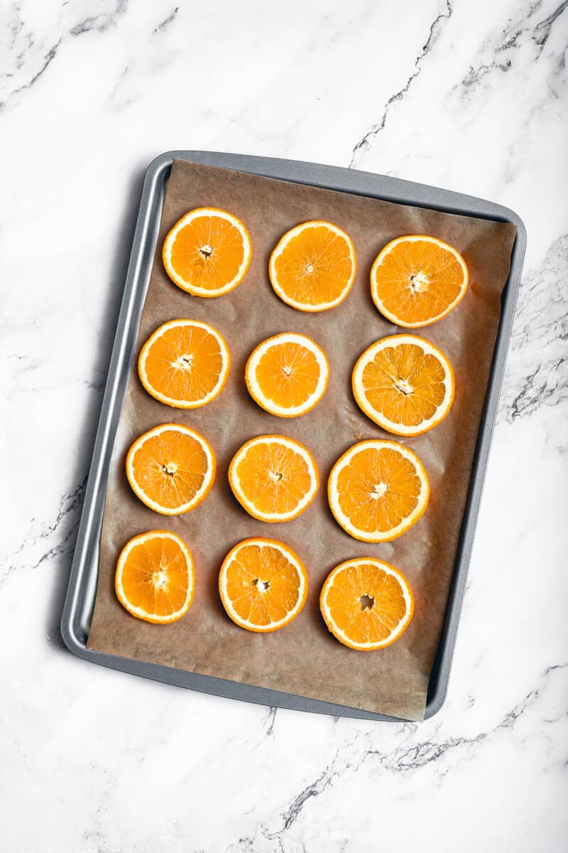 dried orange slices on baking sheet