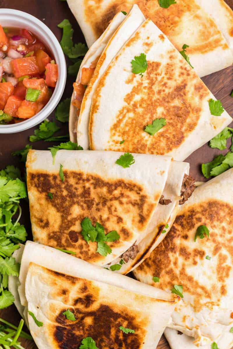 foldover tortilla quesadillas on cutting board