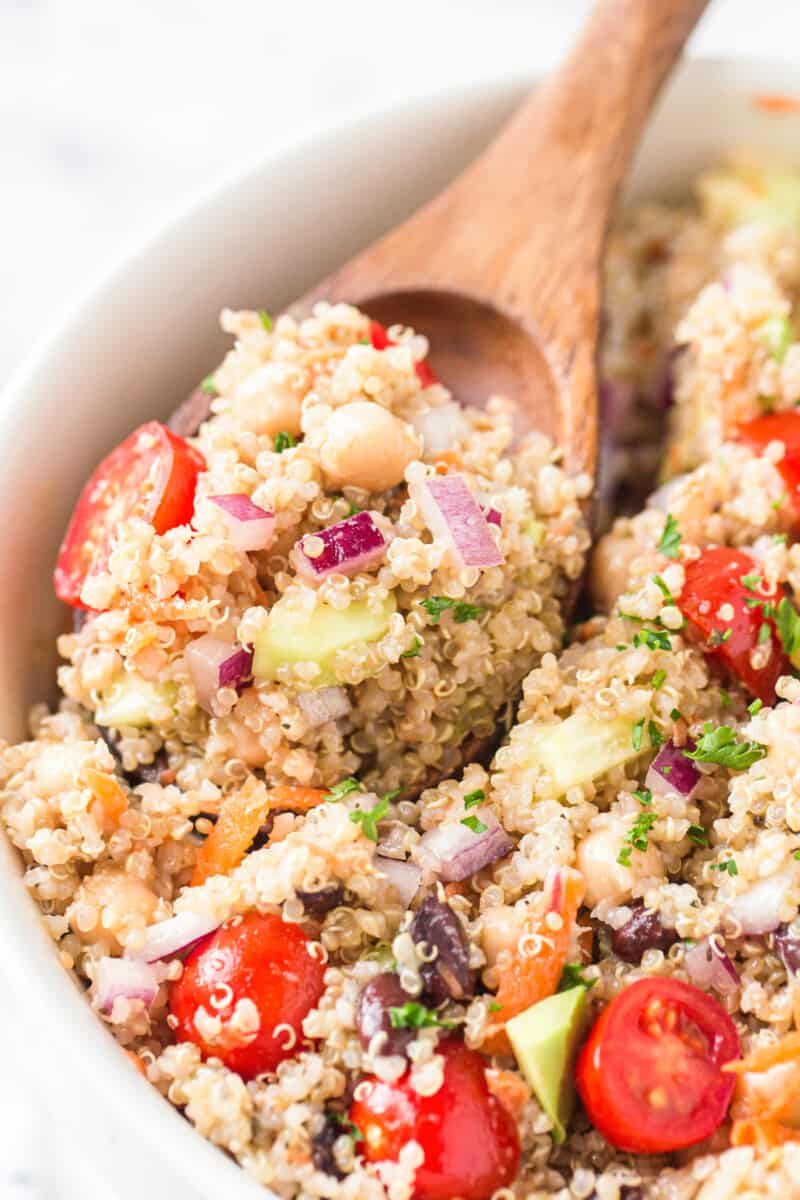 wooden spoon in quinoa salad