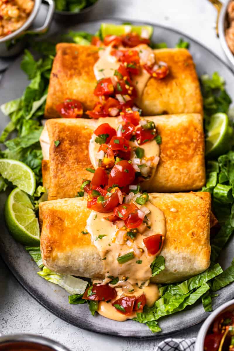 3 baked chicken chimichangas on serving platter