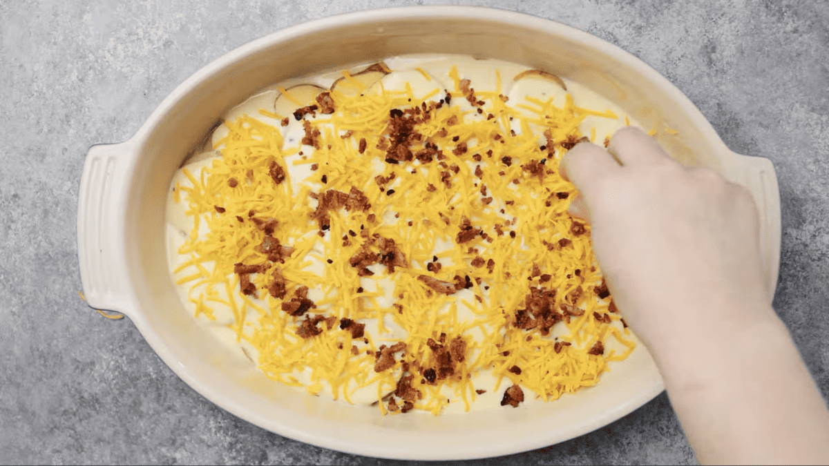 A casserole with potatoes, cheese, and bacon.