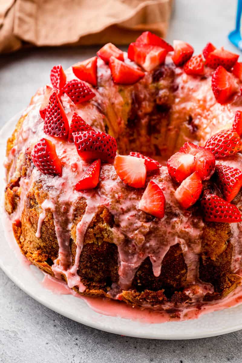 side shot of strawberry pound cake with strawberry glaze