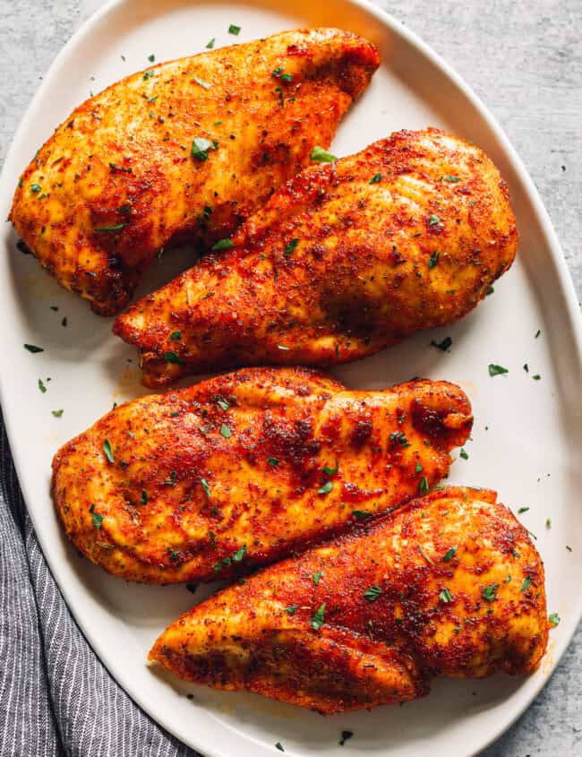 baked chicken breasts on serving platter