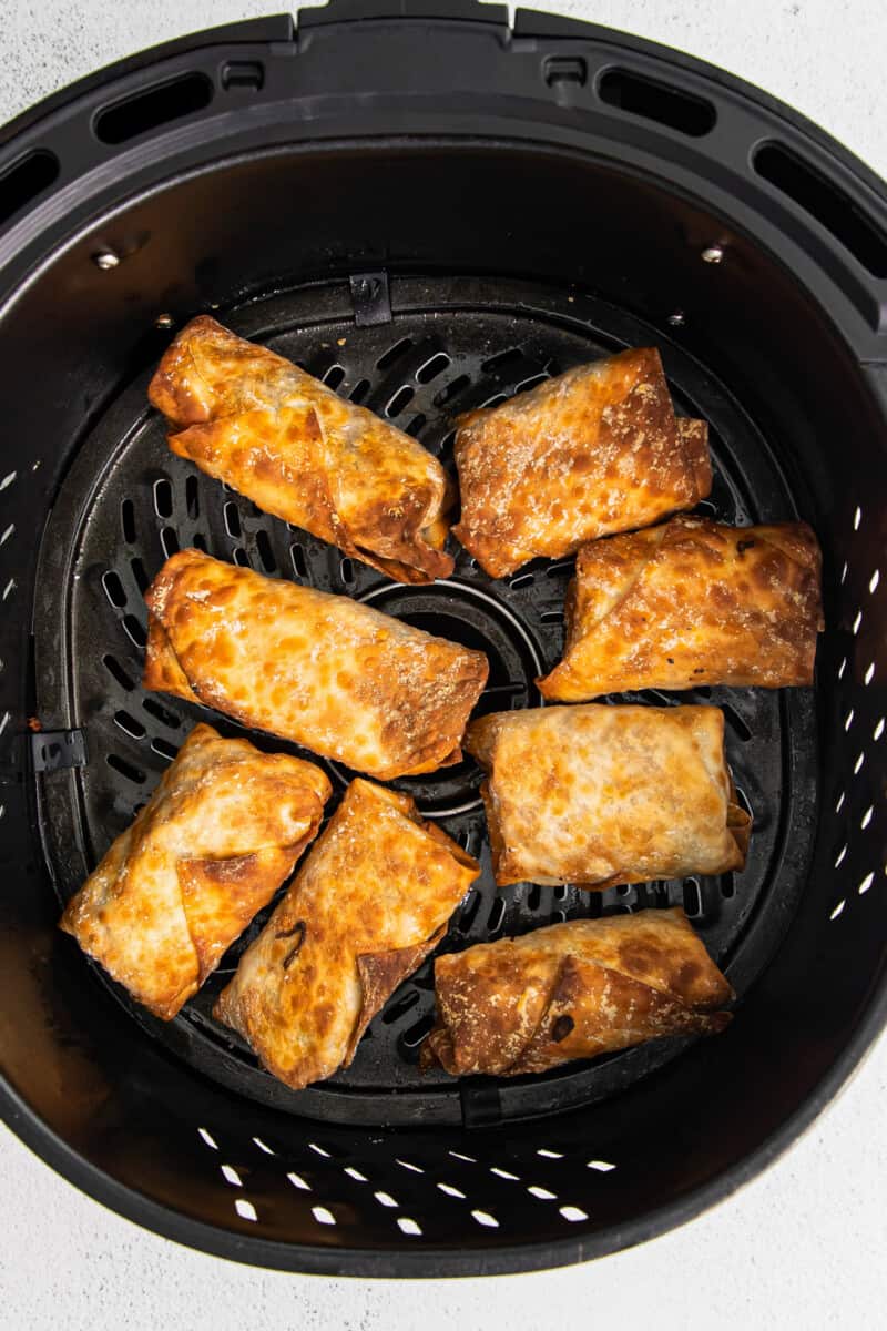 air fryer with egg rolls inside