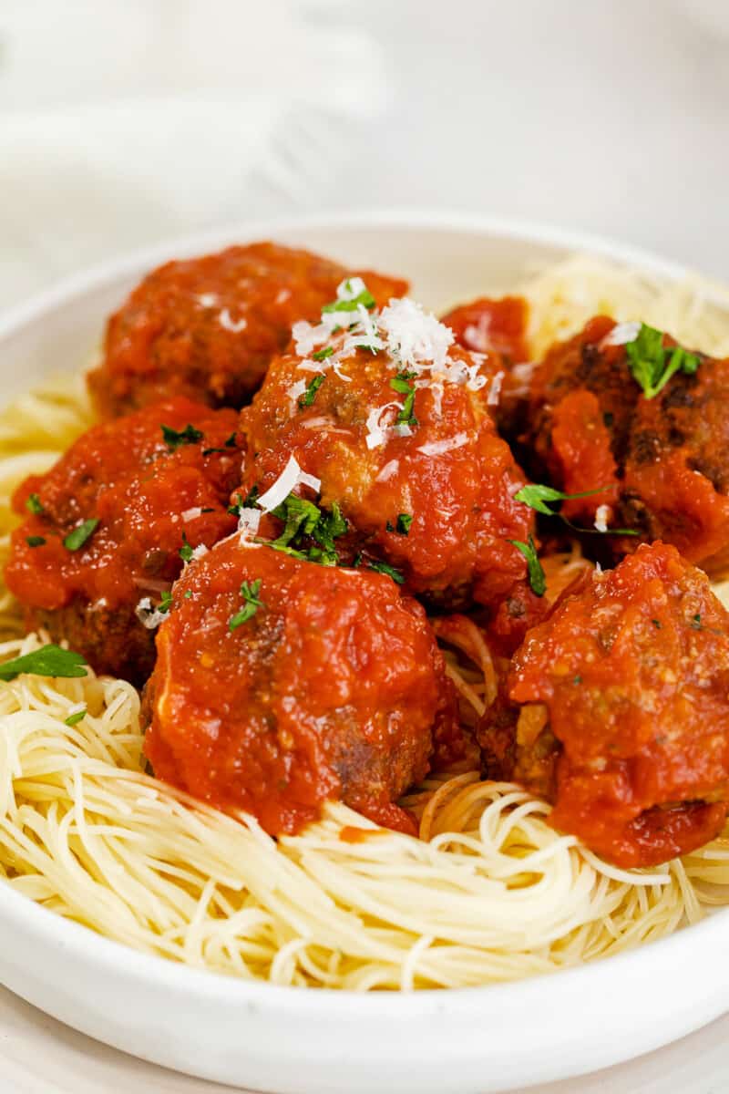 up close air fryer meatballs over pasta