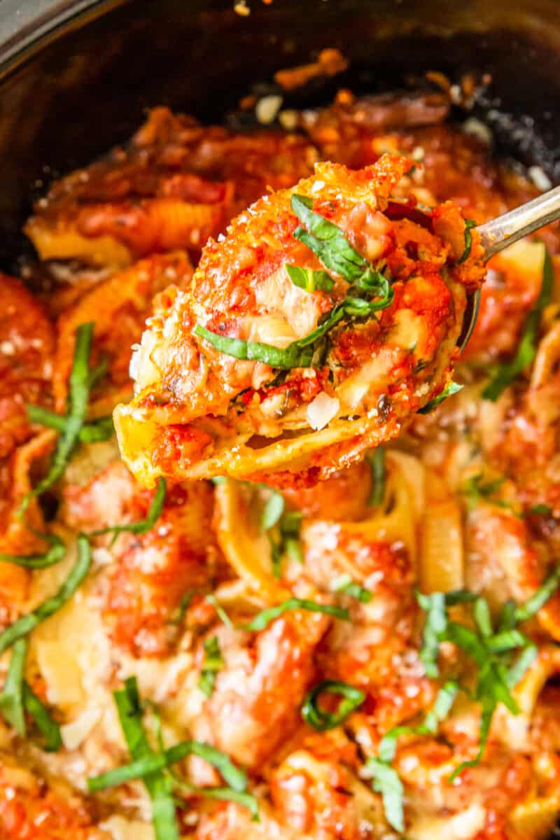 lifting up crockpot stuffed shells