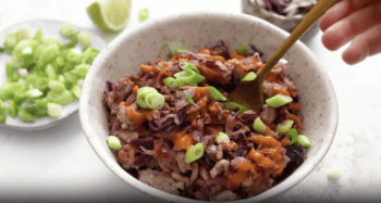 egg roll filling in a white bowl with a fork.