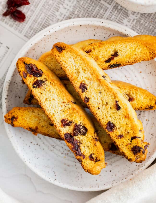 cranberry orange biscotti on gray plate