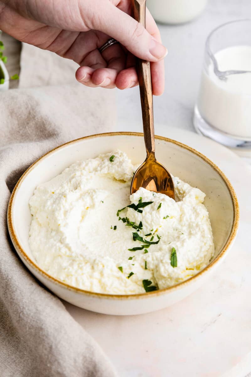 spoon in ricotta in bowl