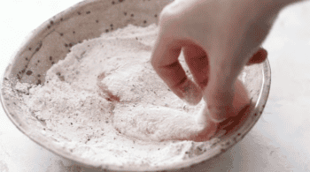 a chicken breast coated in flour.