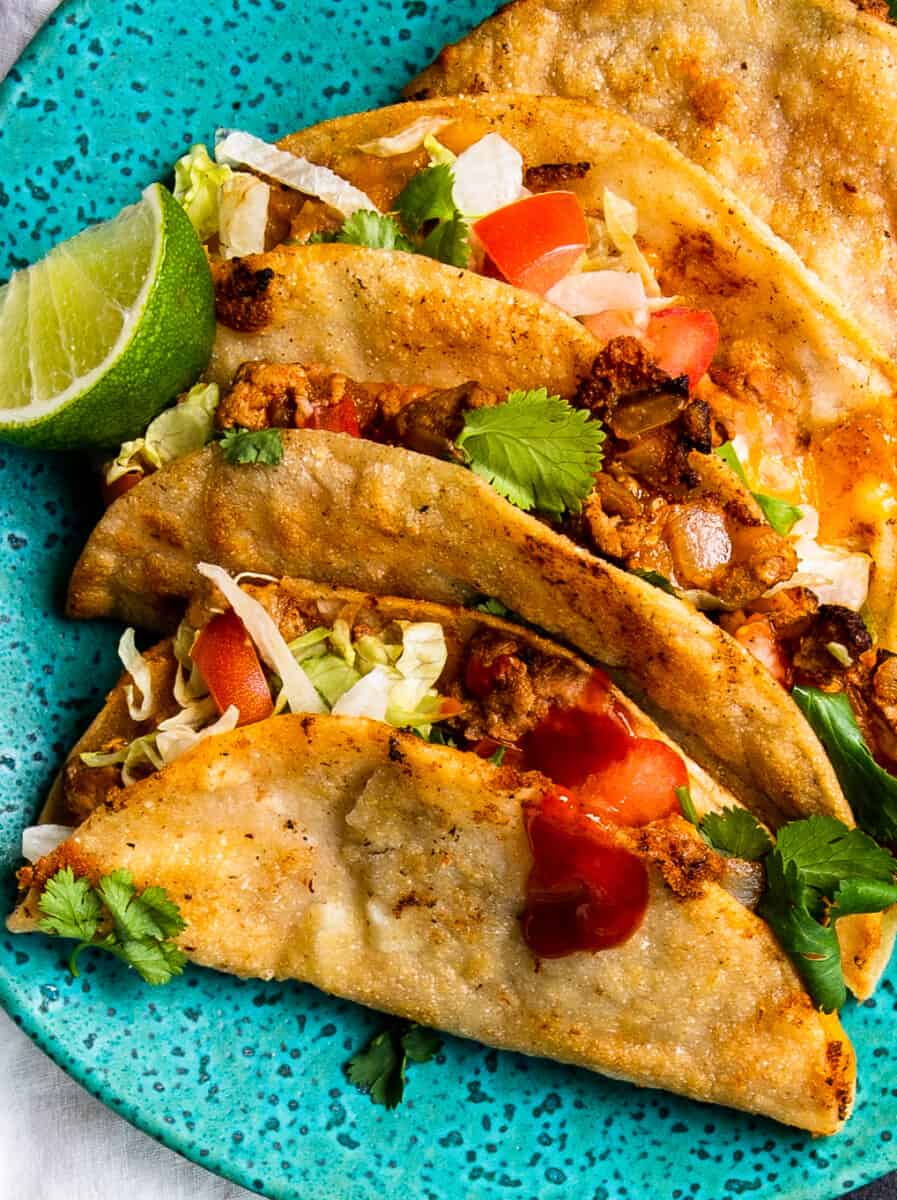 crispy ground turkey tacos on turquoise plate