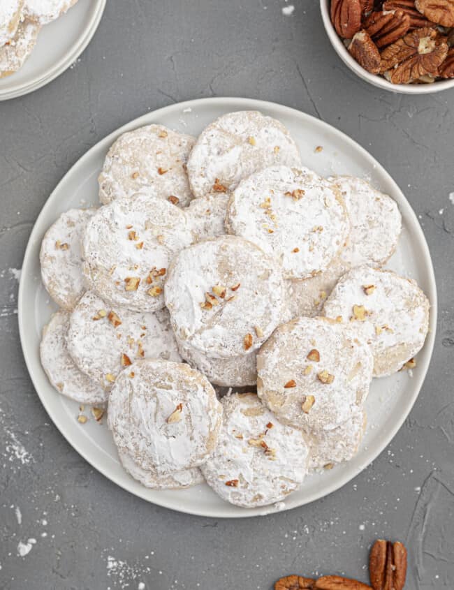 white plate with stacked pecan sandies