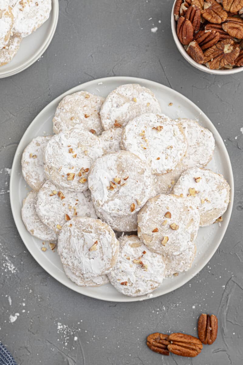 white plate with stacked pecan sandies