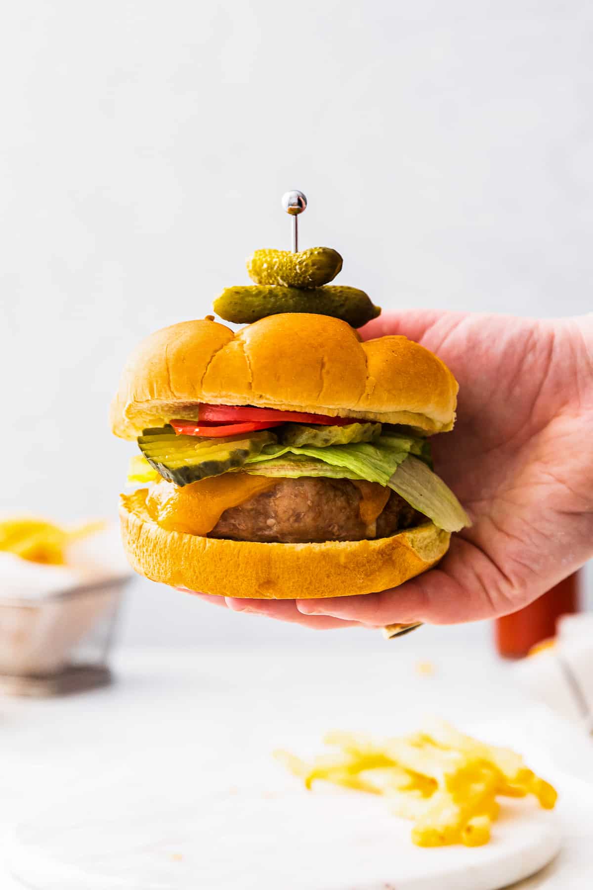 holding up air fryer turkey burger