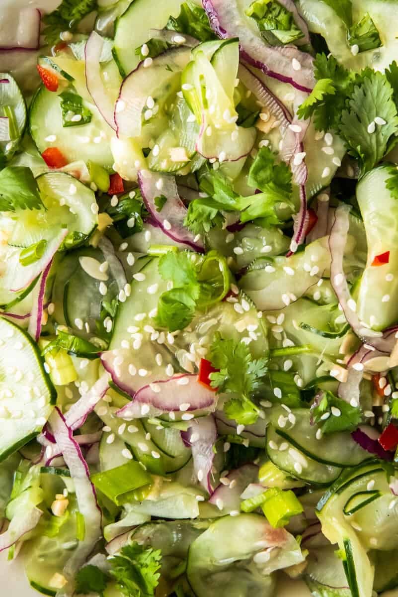 asian cucumber salad garnished with sesame seeds