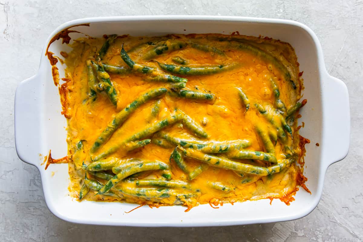 cheesy green beans in a baking dish.