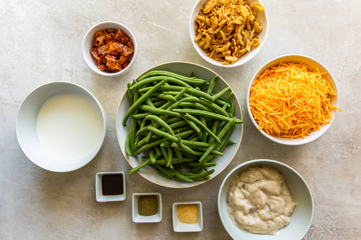 ingredients for green bean casserole with cheese and bacon.