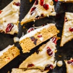 overhead sliced cranberry bliss bars on black platter