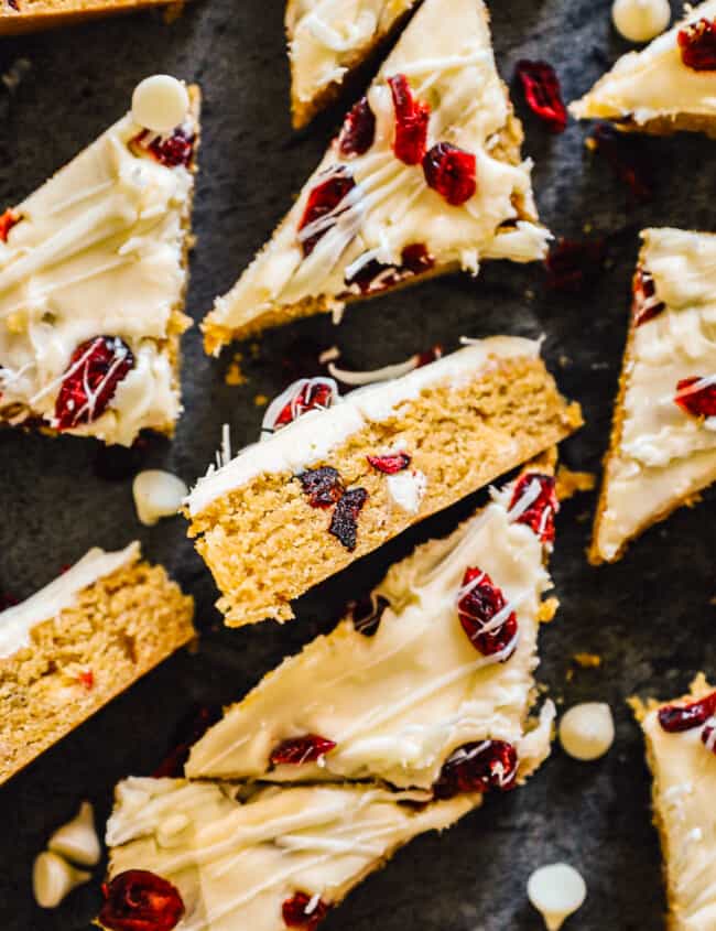 overhead sliced cranberry bliss bars on black platter